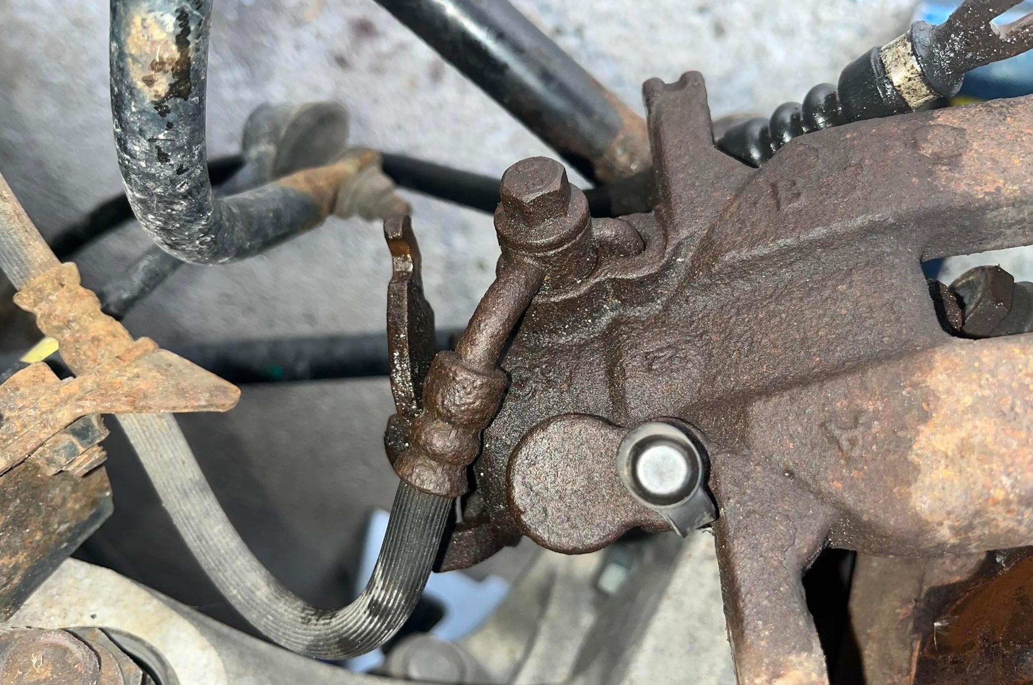 brake caliper leaking fluid from piston