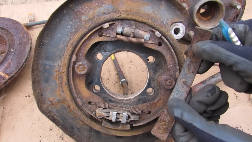 how parking brake works on disc brakes